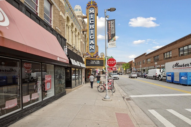 555 E William St, Ann Arbor, MI 48104 - view of asphalt street featuring sidewalks, street lights, and curbs