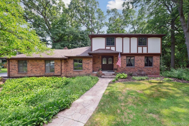 2915 Hillendale Dr, Rochester Hills, MI 48309 - tudor-style house with brick siding and a front yard