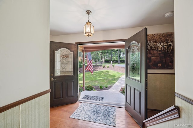 2915 Hillendale Dr, Rochester Hills, MI 48309 - foyer with light wood-style floors and a wainscoted wall