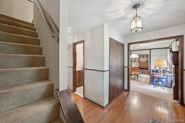 2915 Hillendale Dr, Rochester Hills, MI 48309 - foyer featuring light wood finished floors, stairs, and wainscoting