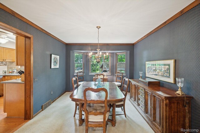 2915 Hillendale Dr, Rochester Hills, MI 48309 - dining room with crown molding, a chandelier, and wallpapered walls