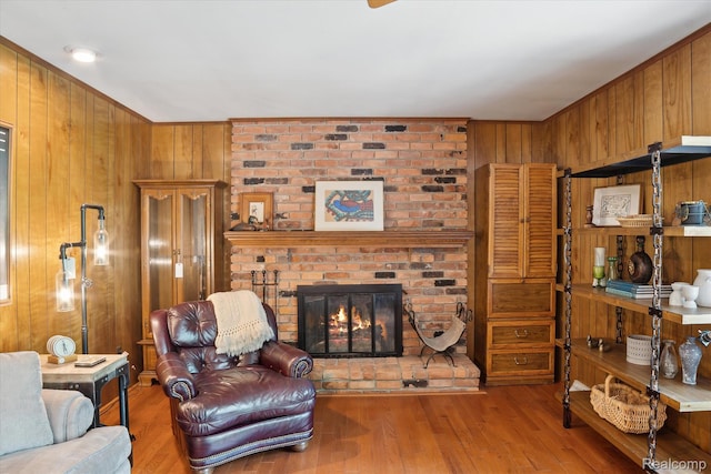 2915 Hillendale Dr, Rochester Hills, MI 48309 - living room with wooden walls, wood finished floors, and a fireplace