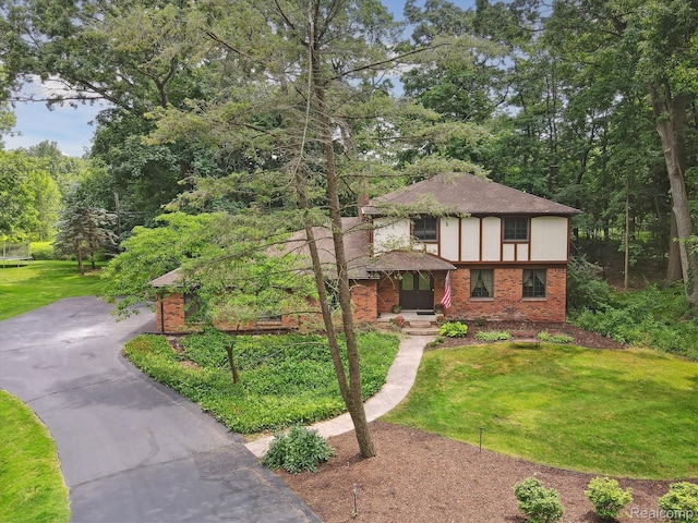 2915 Hillendale Dr, Rochester Hills, MI 48309 - view of front of home featuring brick siding, a front lawn, driveway, and roof with shingles