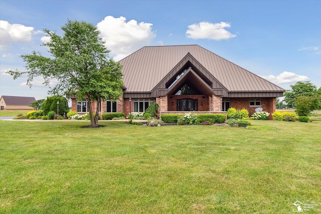 8650 Stone Rd, Maybee, MI 48159 - view of front of home with a standing seam roof, a front lawn, and a metal roof