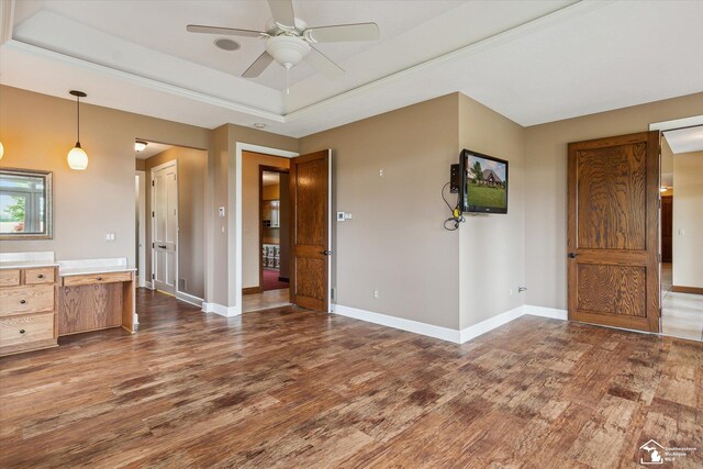 8650 Stone Rd, Maybee, MI 48159 - unfurnished living room with wood finished floors, ceiling fan, and a raised ceiling