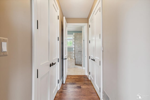 8650 Stone Rd, Maybee, MI 48159 - corridor featuring dark wood-style floors and baseboards