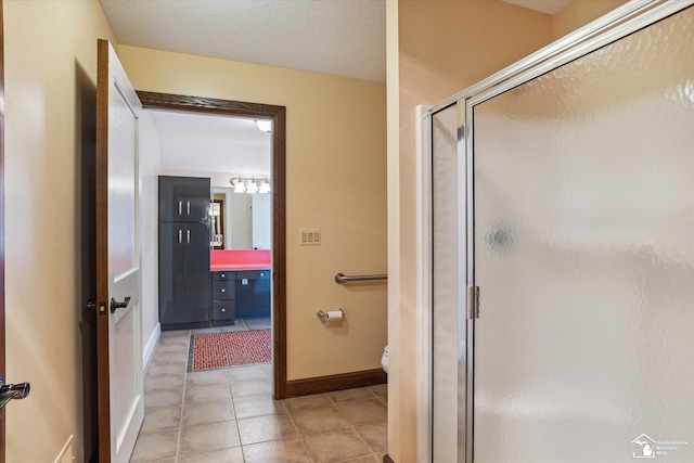 8650 Stone Rd, Maybee, MI 48159 - bathroom featuring a stall shower, vanity, and tile patterned floors
