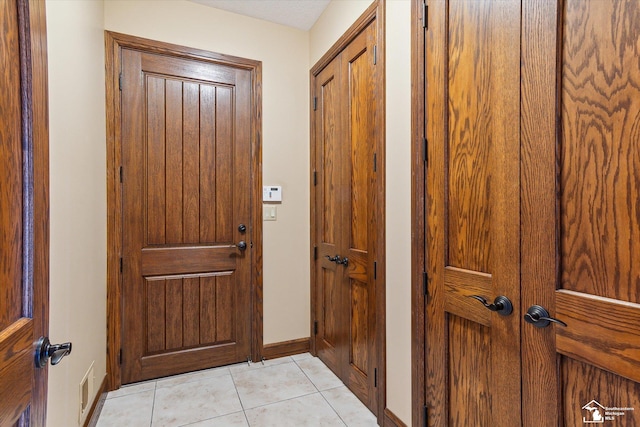 8650 Stone Rd, Maybee, MI 48159 - entryway with light tile patterned flooring and baseboards