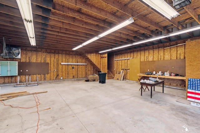 8650 Stone Rd, Maybee, MI 48159 - miscellaneous room featuring unfinished concrete flooring and a garage