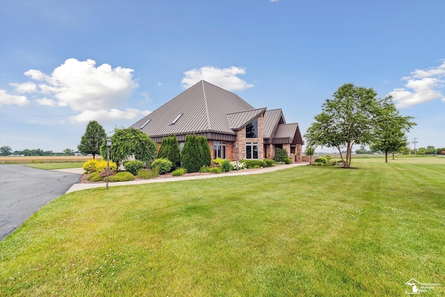 8650 Stone Rd, Maybee, MI 48159 - view of front facade featuring a standing seam roof, a front lawn, and a metal roof