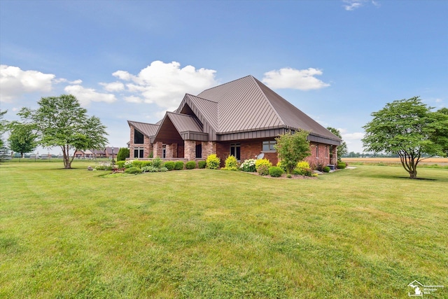 8650 Stone Rd, Maybee, MI 48159 - view of front facade with a standing seam roof, a front lawn, and a metal roof