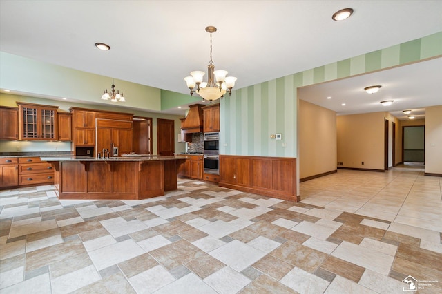 8650 Stone Rd, Maybee, MI 48159 - kitchen with a chandelier, paneled refrigerator, stainless steel double oven, brown cabinetry, and wallpapered walls