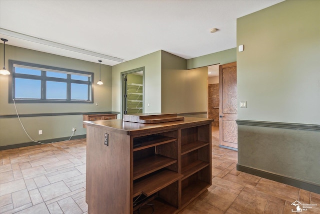 8650 Stone Rd, Maybee, MI 48159 - kitchen featuring stainless steel countertops, hanging light fixtures, and open shelves