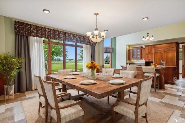 8650 Stone Rd, Maybee, MI 48159 - dining room with a chandelier and stone tile floors