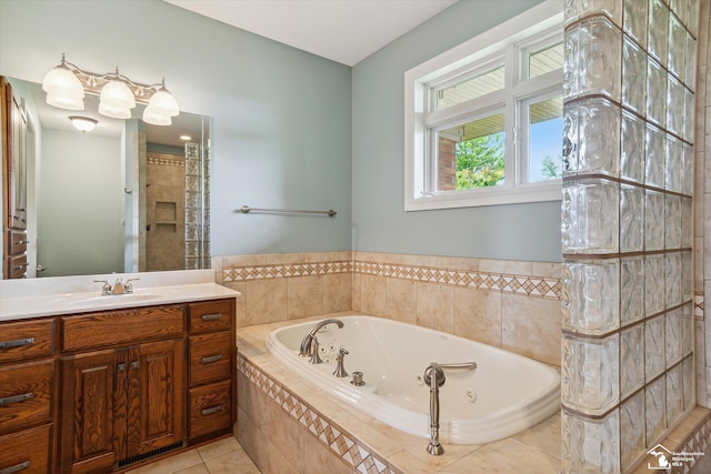 8650 Stone Rd, Maybee, MI 48159 - full bathroom featuring a tub with jets, vanity, and tile patterned floors