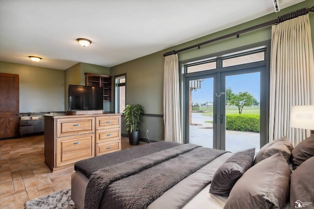 8650 Stone Rd, Maybee, MI 48159 - bedroom featuring access to outside, french doors, and light stone finish flooring