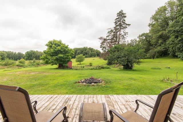wooden terrace with a yard