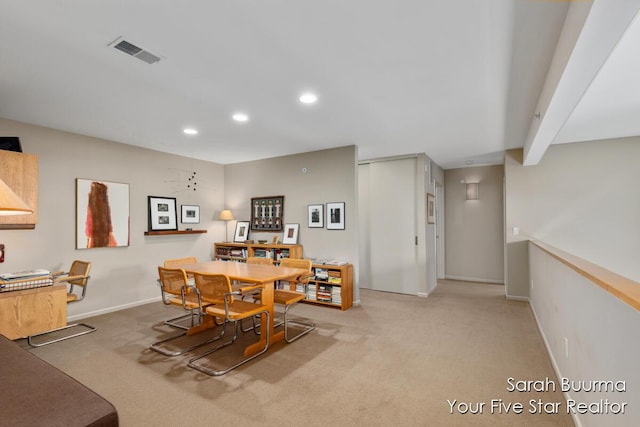 carpeted dining room featuring recessed lighting, baseboards, and visible vents