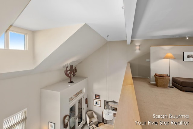 interior details with carpet flooring, a fireplace, and beamed ceiling