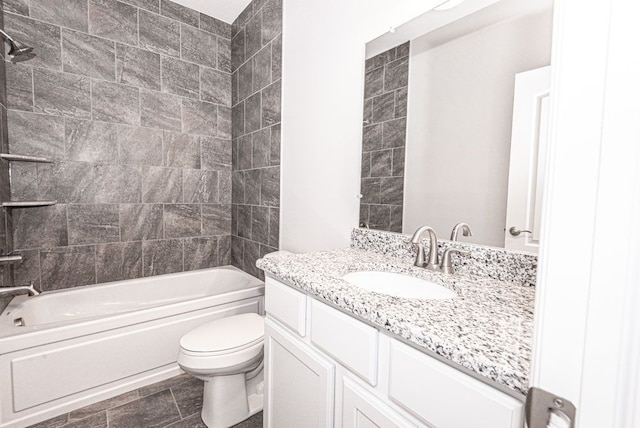full bathroom featuring bathtub / shower combination, toilet, and vanity