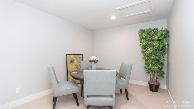 dining area with attic access, recessed lighting, light colored carpet, and baseboards
