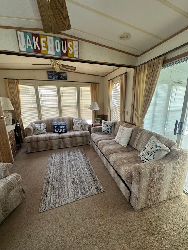carpeted living room with lofted ceiling and ornamental molding