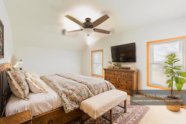 bedroom featuring a ceiling fan, baseboards, and lofted ceiling