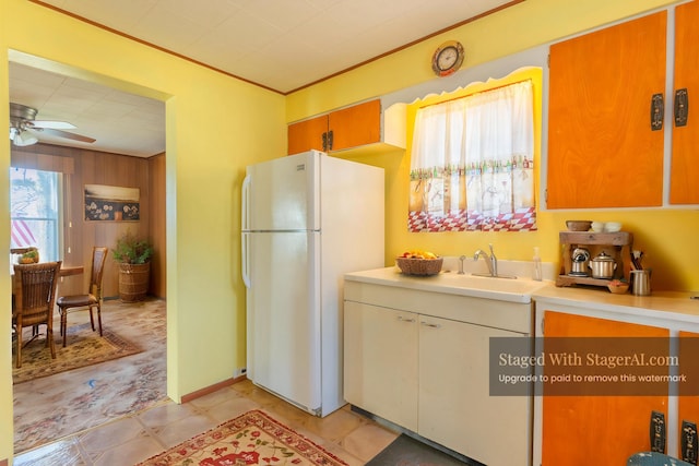 kitchen with freestanding refrigerator, light countertops, and ceiling fan