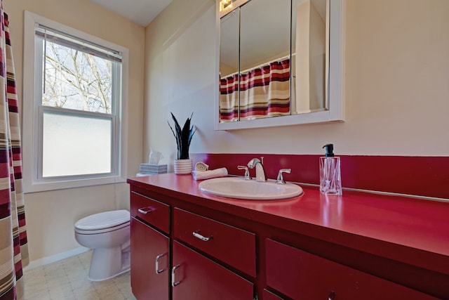 bathroom featuring toilet, vanity, tile patterned floors, and a shower with shower curtain