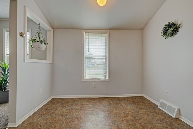 spare room featuring baseboards, visible vents, and stone finish floor