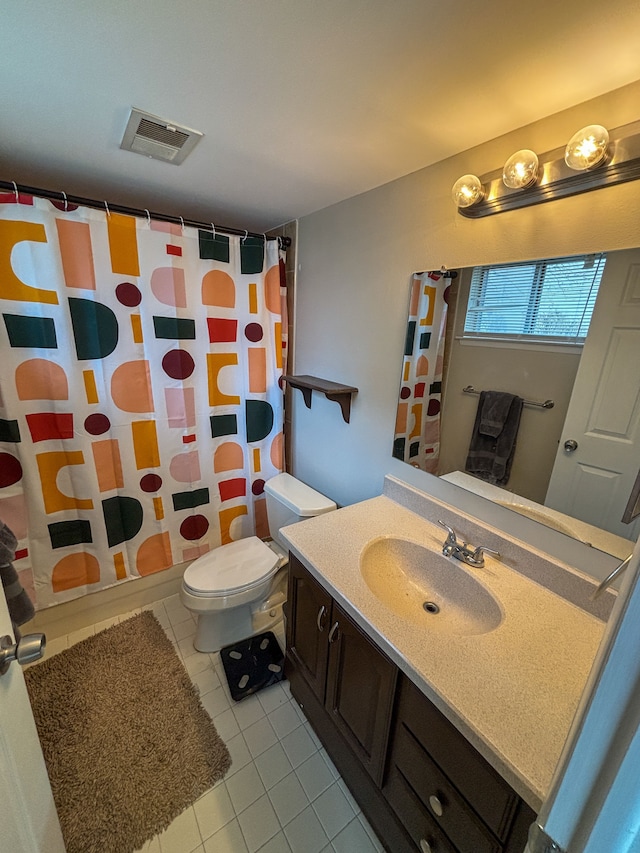 bathroom featuring toilet, visible vents, a shower with shower curtain, tile patterned flooring, and vanity