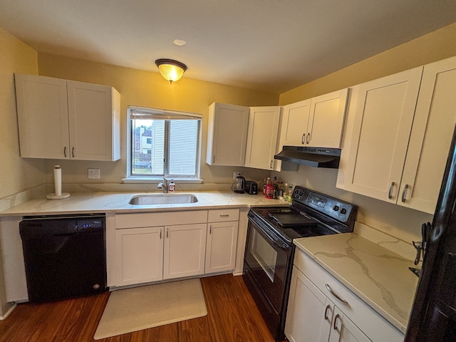 kitchen featuring a sink, black appliances, under cabinet range hood, dark wood-style flooring, and white cabinets
