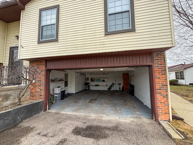 garage featuring aphalt driveway
