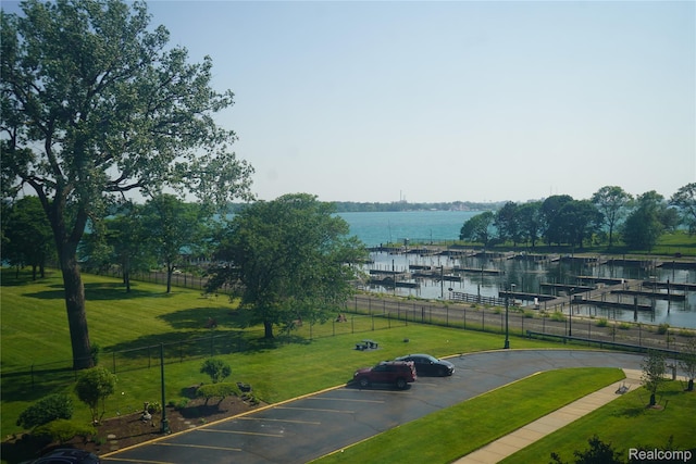 8900 E Jefferson Ave Unit 420 421, Detroit, MI 48214 - view of community with a water view, uncovered parking, and a dock