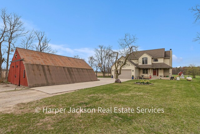 exterior space with a front lawn, a chimney, covered porch, driveway, and roof with shingles
