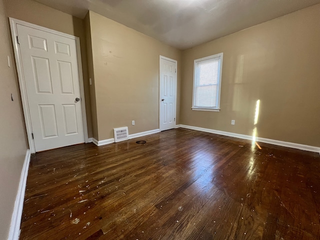 10026 Coyle St, Detroit, MI 48227 - unfurnished room featuring baseboards, visible vents, and hardwood / wood-style flooring