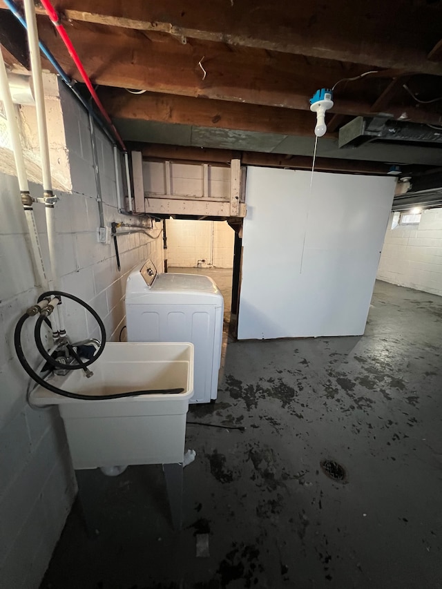 10026 Coyle St, Detroit, MI 48227 - unfinished below grade area with concrete block wall, a sink, and washing machine and dryer