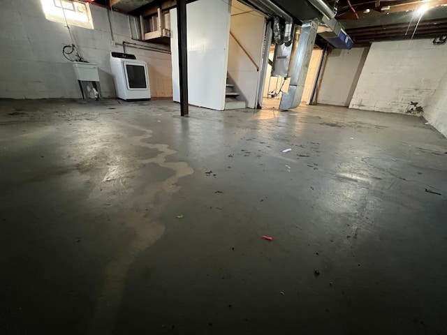 10026 Coyle St, Detroit, MI 48227 - unfinished basement featuring concrete block wall, a sink, washer / dryer, and stairs