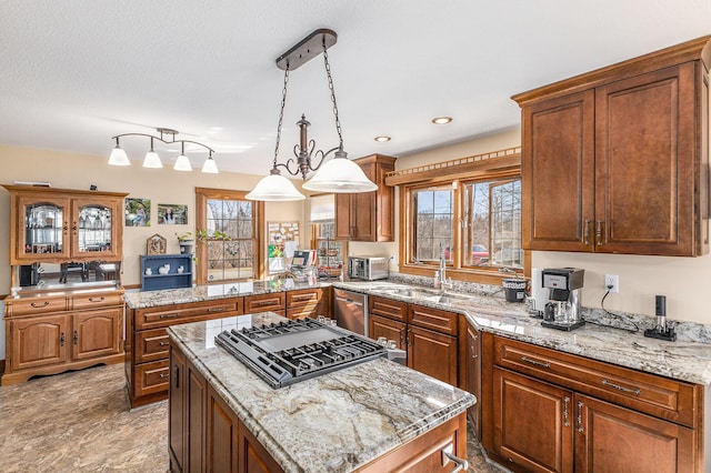 10541 S Jackson Rd, Cement City, MI 49233 - kitchen with a sink, stainless steel dishwasher, a kitchen island, and plenty of natural light