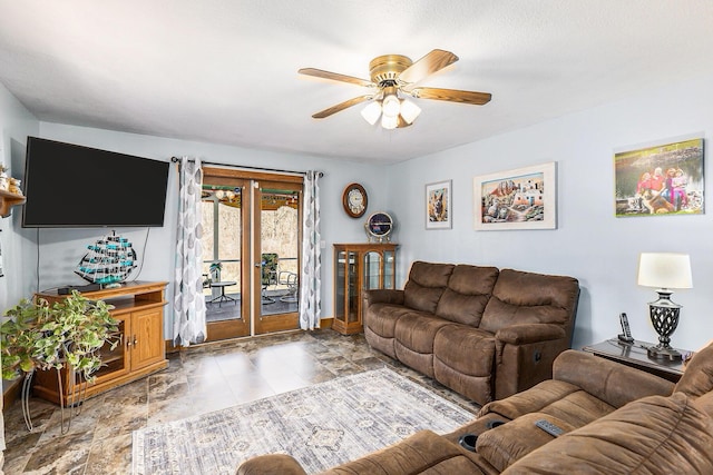 10541 S Jackson Rd, Cement City, MI 49233 - living room with baseboards, french doors, and a ceiling fan