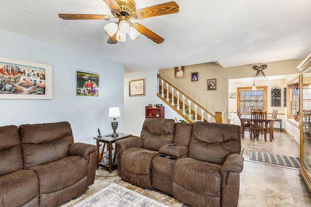 10541 S Jackson Rd, Cement City, MI 49233 - living area featuring stairs and ceiling fan