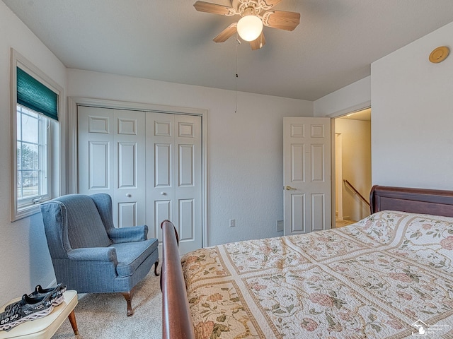 bedroom with ceiling fan, a closet, and carpet floors