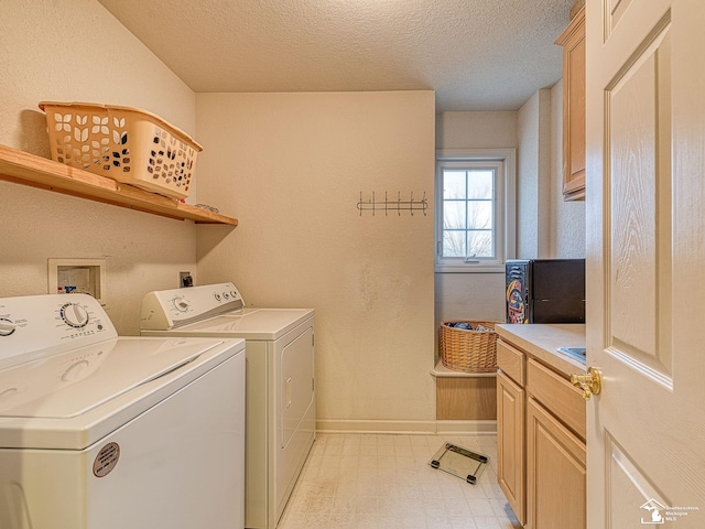 laundry area featuring baseboards, a textured ceiling, independent washer and dryer, and light floors