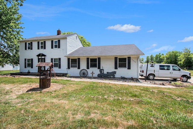 12225 Miller Rd, Grand Blanc, MI 48449 - colonial-style house featuring a chimney and a front lawn