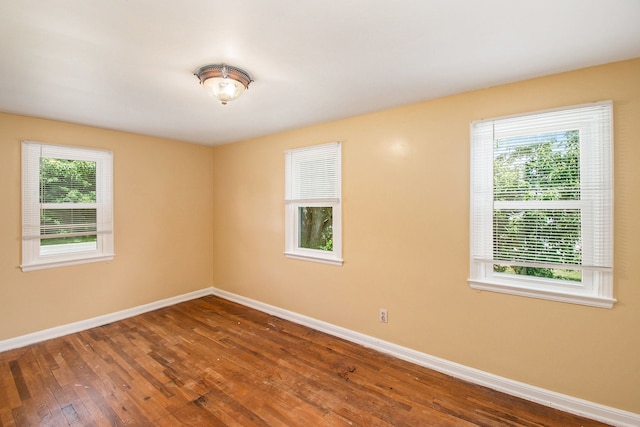 12225 Miller Rd, Grand Blanc, MI 48449 - unfurnished room featuring baseboards and hardwood / wood-style floors