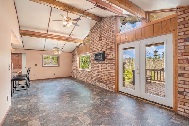 unfurnished living room with stone finish flooring, visible vents, baseboards, and french doors