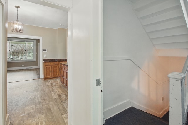 880 White Ave, Lincoln Park, MI 48146 - interior space with a chandelier, light wood finished floors, and baseboards