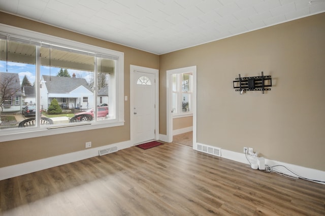 880 White Ave, Lincoln Park, MI 48146 - entrance foyer with visible vents, baseboards, and wood finished floors
