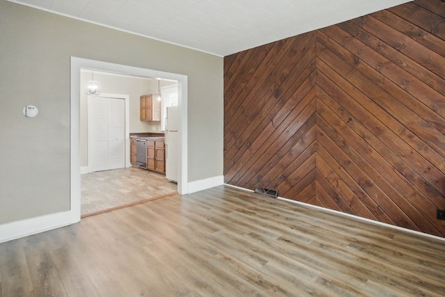 880 White Ave, Lincoln Park, MI 48146 - spare room with wine cooler, visible vents, light wood-style flooring, and baseboards