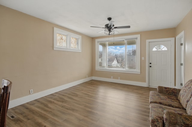 880 White Ave, Lincoln Park, MI 48146 - living area featuring visible vents, ceiling fan, wood finished floors, and baseboards